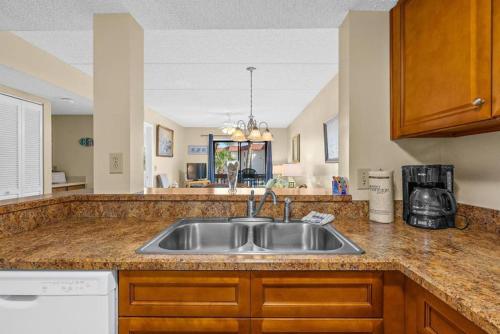a kitchen with a sink and a counter top at 6206 Courtyard Villa 2nd Fl S in Saint Augustine