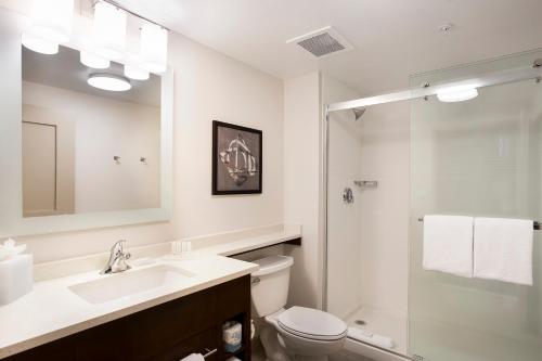 a bathroom with a sink and a toilet and a shower at TownePlace Suites by Marriott San Mateo Foster City in Foster City