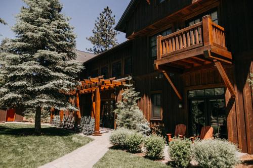 a house with a christmas tree in front of it at FivePine Lodge in Sisters