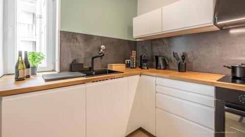 Η κουζίνα ή μικρή κουζίνα στο FLAIR: stylisches Apartment - Netflix - BASF - Uni Mannheim