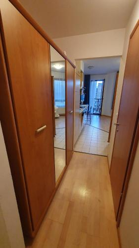 an empty hallway with a door and a room at Princess and Prince Apartman in Budapest