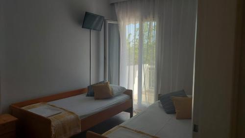 Postel nebo postele na pokoji v ubytování LENIA
