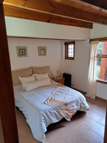 מיטה או מיטות בחדר ב-Casa Alta 8