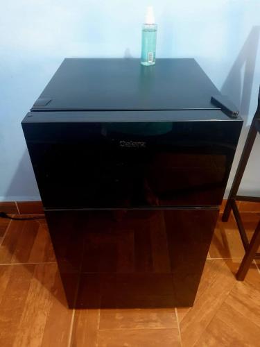 a black desk with a candle on top of it at ESTUDIO EL ANGEL. in Santa Cruz Huatulco