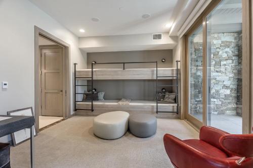 a room with two bunk beds and a couch at Stein Eriksen Residences in Park City