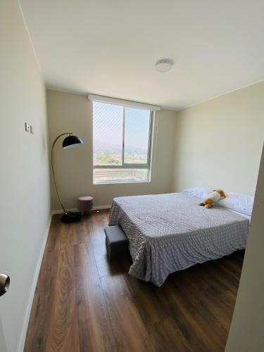 a bedroom with a bed and a window at Habitación en miraflores in Lima