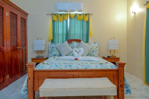 a bedroom with a bed with a stuffed animal on it at DD'S Vacation Property in Harveys