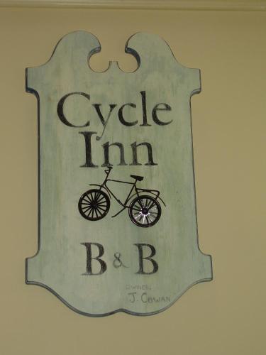 a sign that says cycle inn bebb on a wall at Cycle Inn Bed and Breakfast in Langford