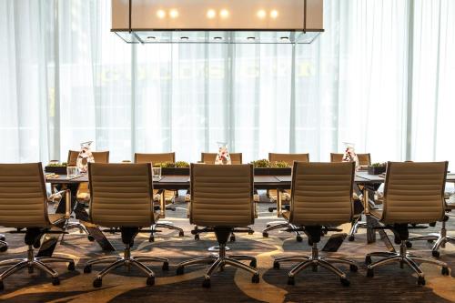 a conference room with a long table and chairs at Kimpton Hotel Palomar Phoenix Cityscape by IHG in Phoenix