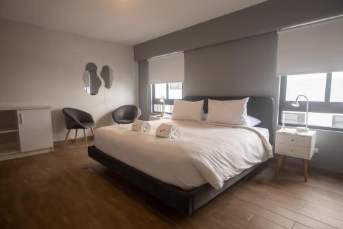 En eller flere senge i et værelse på Modern 2BR in Miraflores