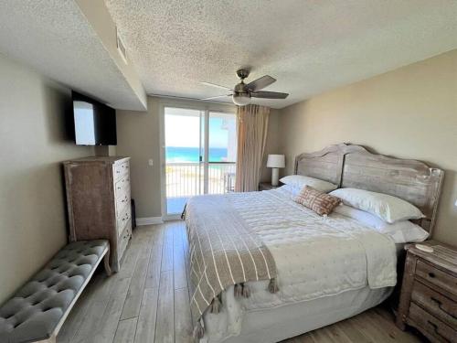 a bedroom with a bed with a view of the ocean at Beachfront Retreat- "The Getaway" in Destin