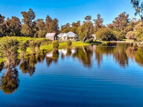 a view of a lake with houses and trees at Secluded rural retreat in Southwest WA in Capel