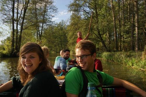 a group of people in a boat on a river at Radduscher Hafen in Vetschau