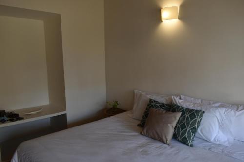 Postel nebo postele na pokoji v ubytování Hostal Magdalena