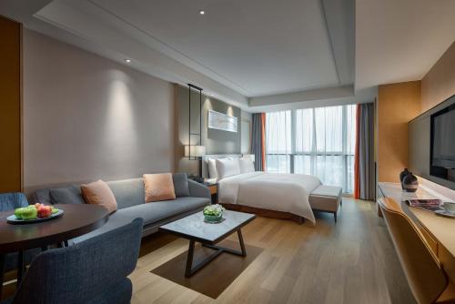 Postel nebo postele na pokoji v ubytování Primus Residence Shanghai Hongqiao