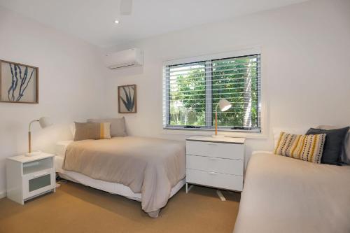 En eller flere senge i et værelse på The Sanctuary