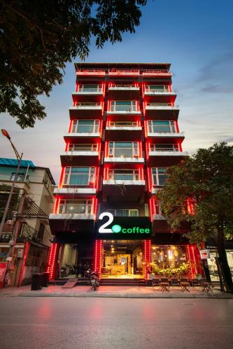 a building with a store sign in front of it at Hai Mươi Hotel & Apartment in Hanoi