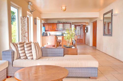 a living room with a couch and a table at Mayumi Beach Villa in Boracay