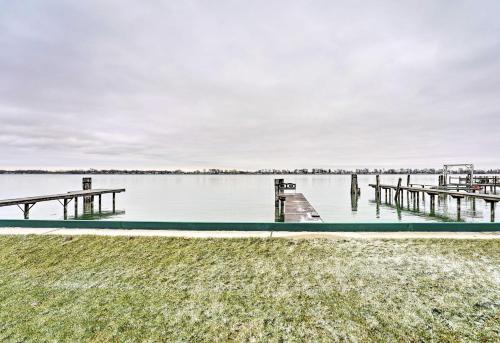 a dock on a body of water at Waterfront East China Home with Dock and Patio! in Marine City