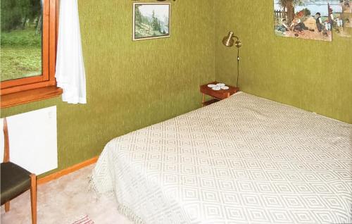 a bedroom with a bed and a window at Holiday Home Curt Ols Väg Borrby in Borrby