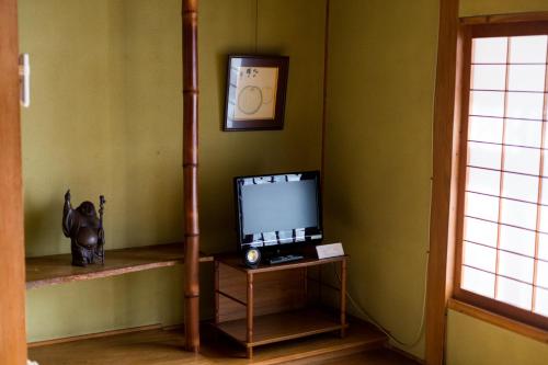 a television sitting on a table in a room at ootaryokan in Kuroki