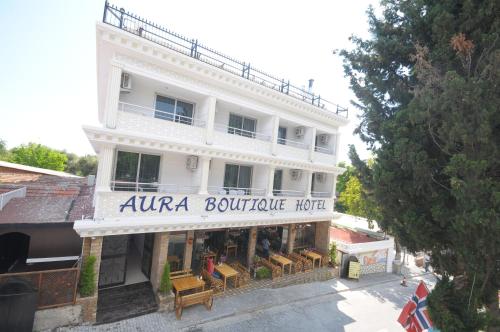 a building with a sign that reads numena boutique hotel at Aura Boutique Hotel in Side