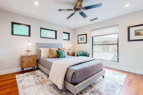 a bedroom with a bed and a ceiling fan at Westbrook Wonder in Austin