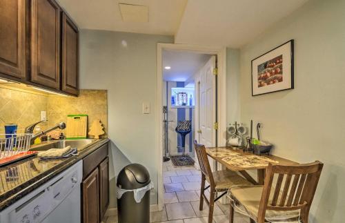 a kitchen with a table and a dining room at Bethesda Apartment and Yard about 9 Mi to D C in Bethesda