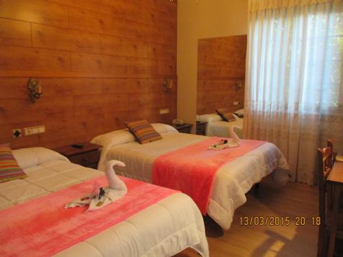 Ένα ή περισσότερα κρεβάτια σε δωμάτιο στο Hotel Playa Samil Vigo
