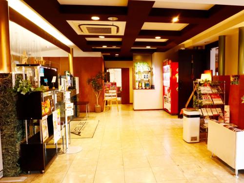 a store hallway with a grocery store with a store at Hotel Abest Shin-Anjo-Ekimae in Anjo