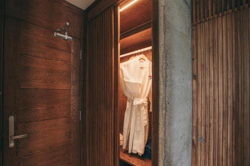 a closet with a shirt hanging in it at JM Boutique Hotel in Phu Quoc
