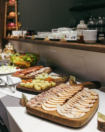 a buffet with several trays of food on a table at JM Boutique Hotel in Phu Quoc