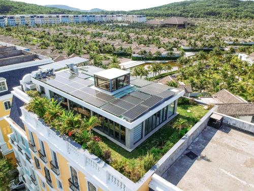 an aerial view of a building with a rooftop garden at JM Boutique Hotel in Phu Quoc