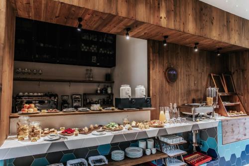 a kitchen with a buffet of food on display at JM Boutique Hotel in Phu Quoc