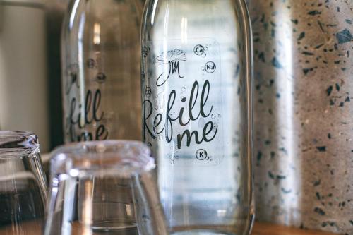 a glass jar with the words in full time written on it at JM Boutique Hotel in Phu Quoc