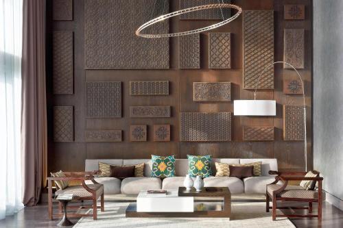 a living room with a white couch and chairs at Le Meridien Istanbul Etiler in Istanbul