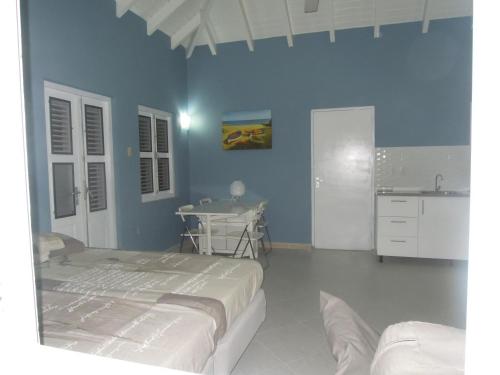 Ένα ή περισσότερα κρεβάτια σε δωμάτιο στο Cattleya Apartments Curacao