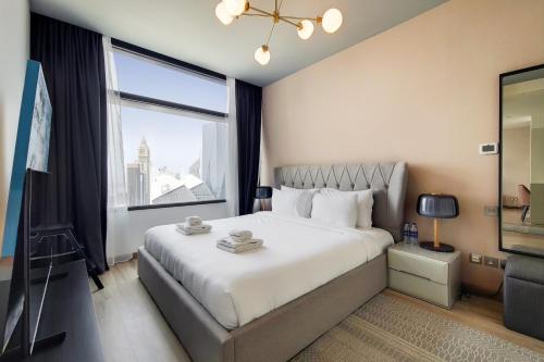 Llit o llits en una habitació de Primestay - Index Tower, DIFC