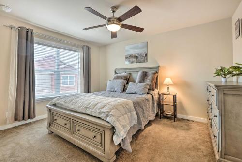 a bedroom with a bed and a ceiling fan at Gypsum Home with Patio Between Glenwood and Vail in Eagle
