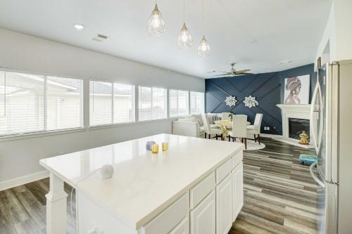 a kitchen with a white counter and a dining room at Houston Vacation Rental with Private Yard! in Houston