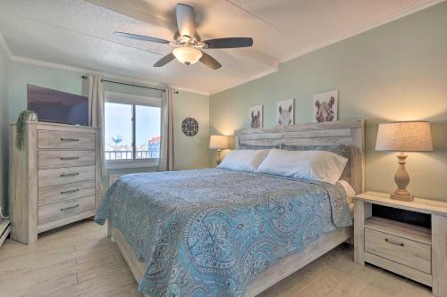 a bedroom with a bed and a ceiling fan at End-Unit Ocean City Condo with Panoramic Views! in Ocean City