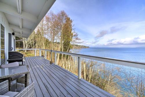 a balcony of a house with a view of the water at Waterfront Kingston Getaway on Puget Sound! in Kingston