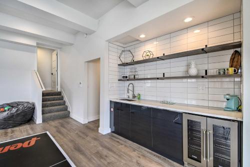 a kitchen with a sink and a counter top at Waterfront Kingston Getaway on Puget Sound! in Kingston