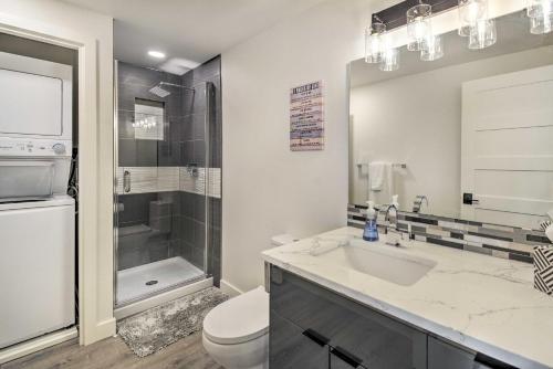 a bathroom with a sink and a toilet and a shower at Waterfront Kingston Getaway on Puget Sound! in Kingston