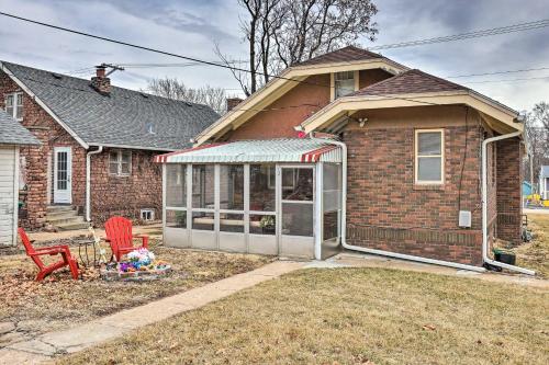 a house with a greenhouse in front of it at Omaha Vacation Rental about 4 Mi to Downtown in Omaha