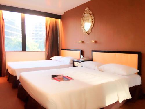 Ένα ή περισσότερα κρεβάτια σε δωμάτιο στο Best Western Plus Tsim Sha Tsui