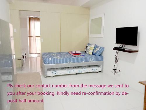 a small room with a bed with at SMDC Tagaytay Taal Lake Condo Cook Netflix No Balcony No Free Parking Contact to Confirm in Tagaytay