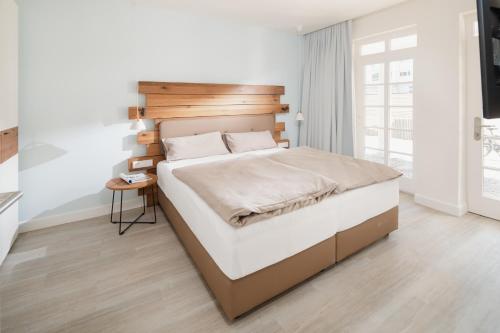 Postel nebo postele na pokoji v ubytování Nordstrandperle Ap S6