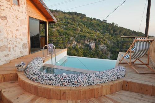 a dog swimming in a pool on a deck at SOAP LADY Hotel and More in Mugla