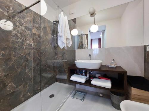 a bathroom with a sink and a shower at Piazza di Spagna - Suite Donata, strollingrome in Rome